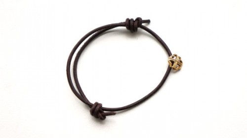 STRENGTH- symbol bracelet- handmade gold plated silver pendant on leather cord